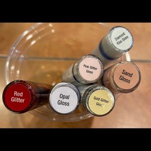 Set of 5 SeneGence glitter glosses.